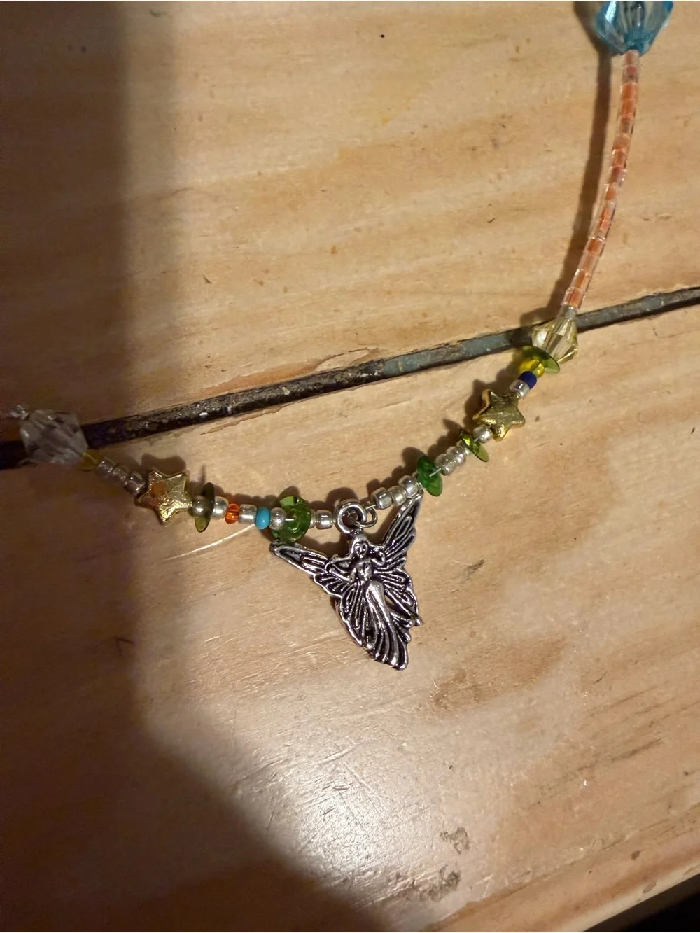 Multicolor Beaded Necklace with Silver Fairy Pendant featuring star charms